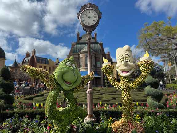 Candlestick and Cogsworth topiaries dance at Disney World EPCOT Flower & Garden Festival