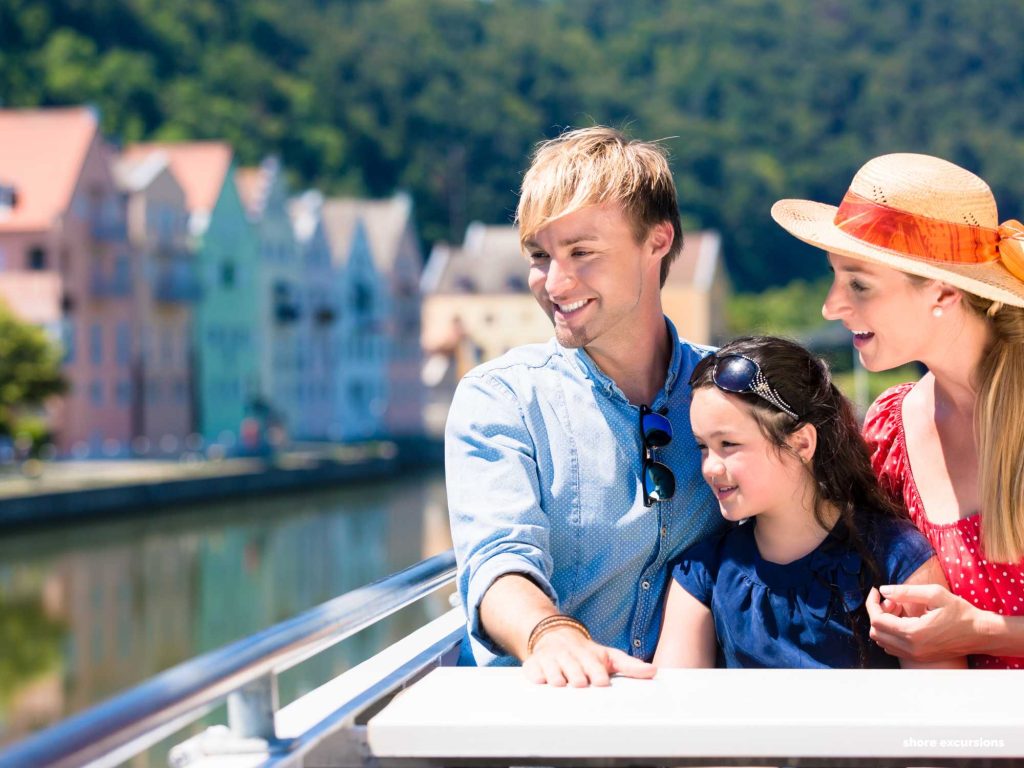 Family enjoying a shore excursion on a cruise, a prime consideration when considering which cruise line is best for families.