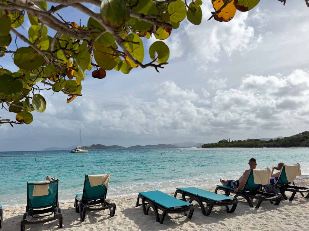 Ocean cruisers enjoing a white sand beach and tourquoise waters on an ocean cruise shore excursion